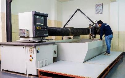 Ballistic testing rig for armour panels